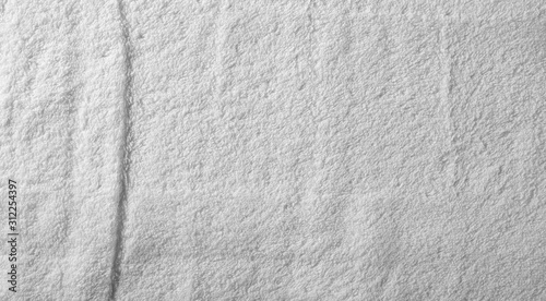 White crumpled textile, terry cloth background and texture