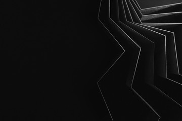 Black background with shiny rays, abstract
