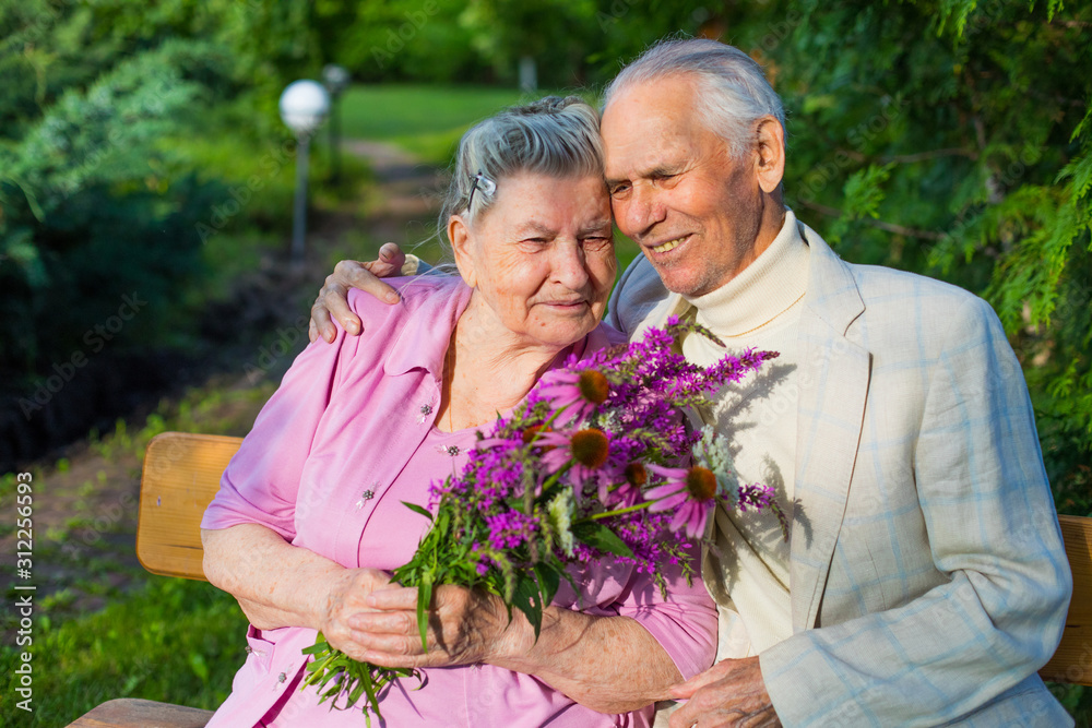 Romantic grandparents 90 years old. Two caucasian senior citizens are embracing each other. Elderly couple marriage in love Romantic grandparents 90 years old. Two caucasian senior citizens are embracing each other. Elderly couple marriage in love