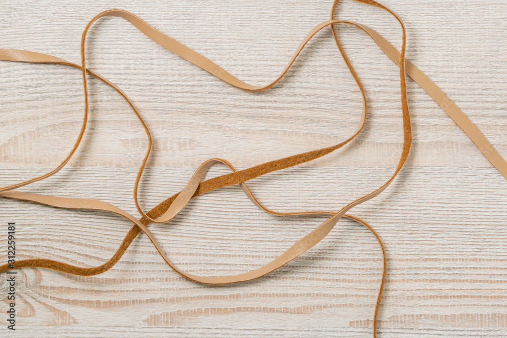 The strap is made of faux leather with a drawstring