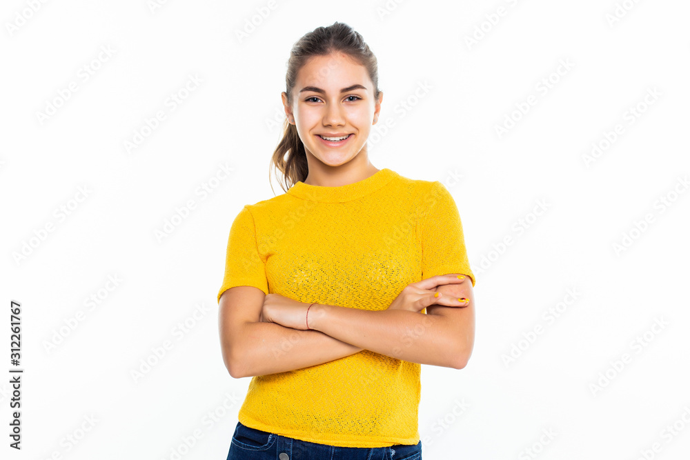 Beautiful teen girl student with confident expression, keeps arms folded. Portrait of smiling teenager isolated on white background. Beautiful teen girl student with confident expression, keeps arms folded. Portrait of smiling teenager isolated on white background.