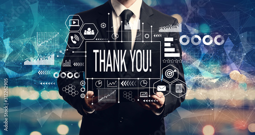 Thank you message with businessman holding a tablet computer photo