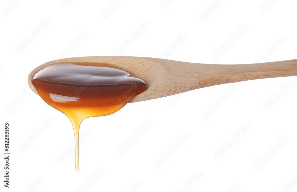 Salted caramel in spoon isolated on white Salted caramel in spoon isolated on white