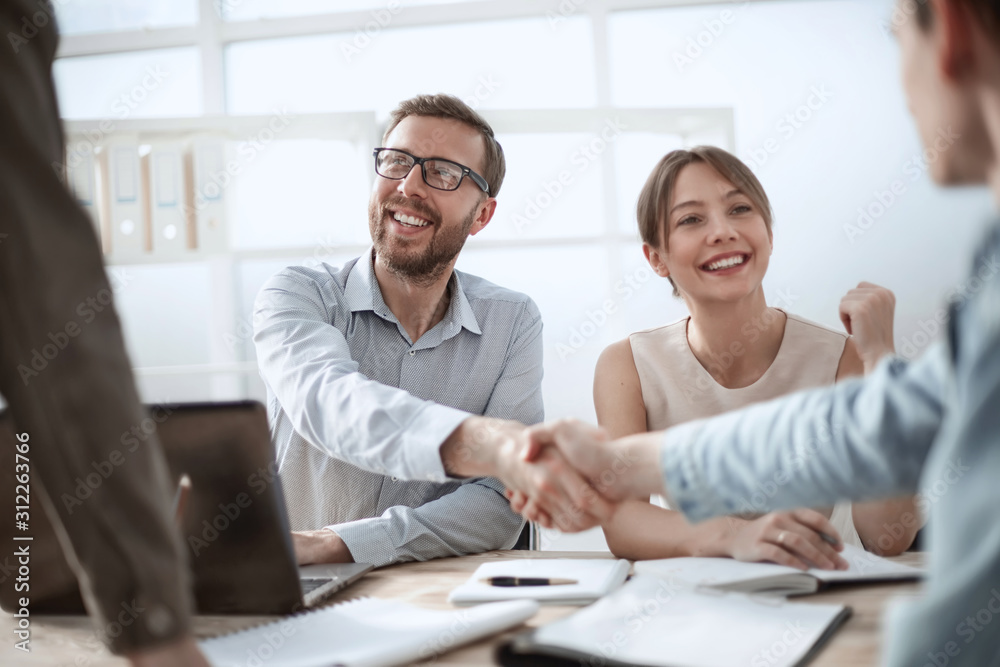 business man shaking hands with his colleague business man shaking hands with his colleague