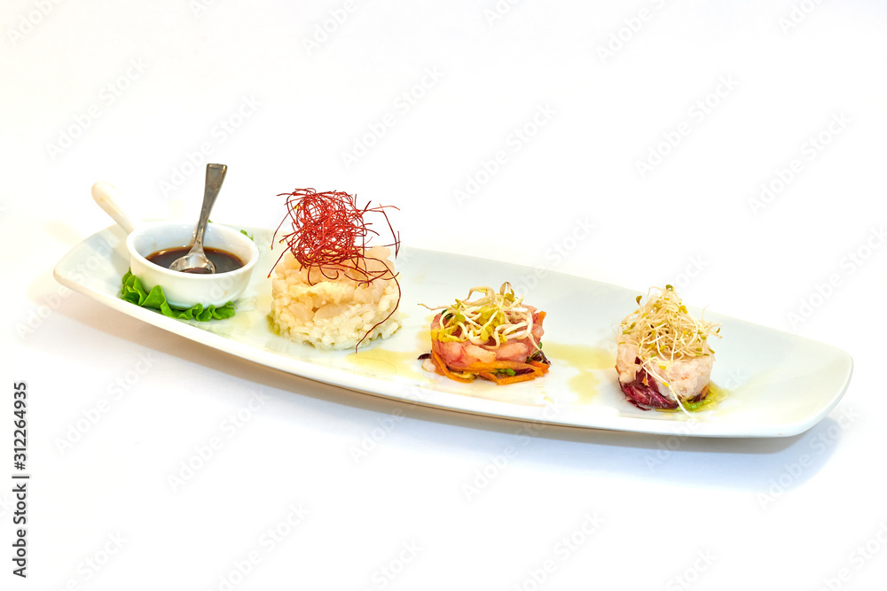 Mixed plate of raw fish, oysters and shrimp tartare