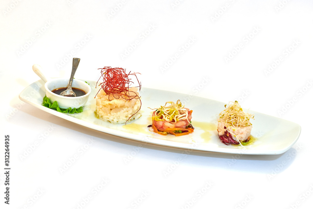 Mixed plate of raw fish, oysters and shrimp tartare Mixed plate of raw fish, oysters and shrimp tartare