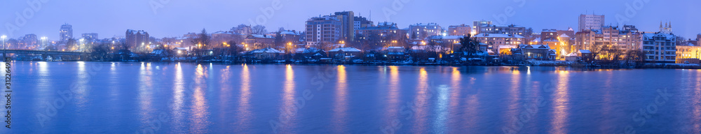 Vinnytsia Night winter city view from the river Southern Bug in the city of Vinnitsa to the central part in winter time. City center view