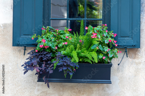 In a city of gardens, a beautiful planter box is seen in the historic district of Charleston, South Carolina, a popular slow travel destination in the southern United States.