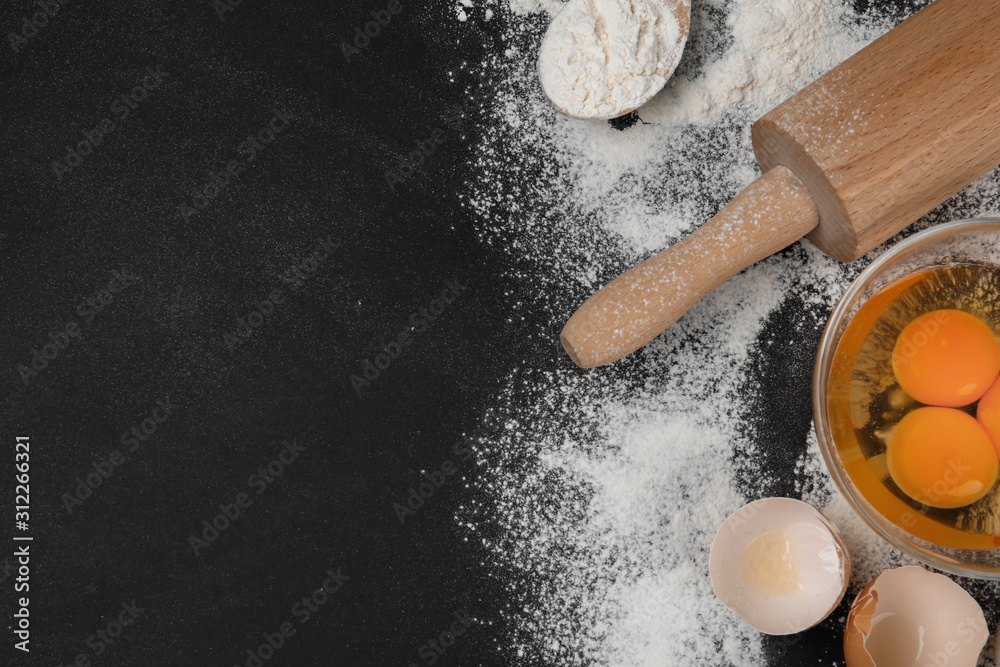 Flat lay composition with eggs and other ingredients on black table, space for text. Baking pie Flat lay composition with eggs and other ingredients on black table, space for text. Baking pie