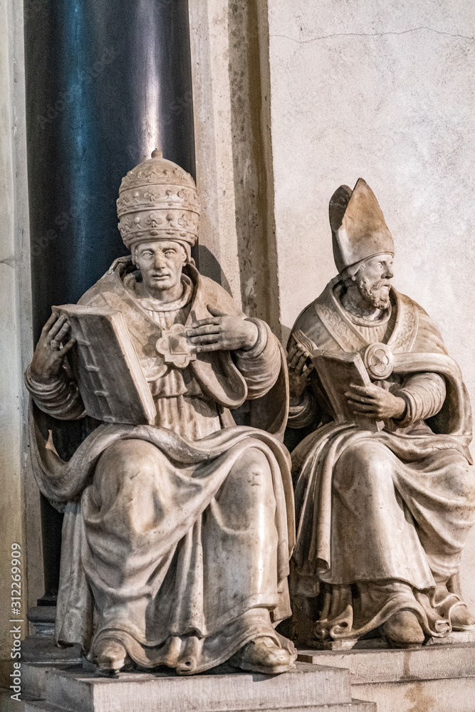 A statue in a small church in France A statue in a small church in France
