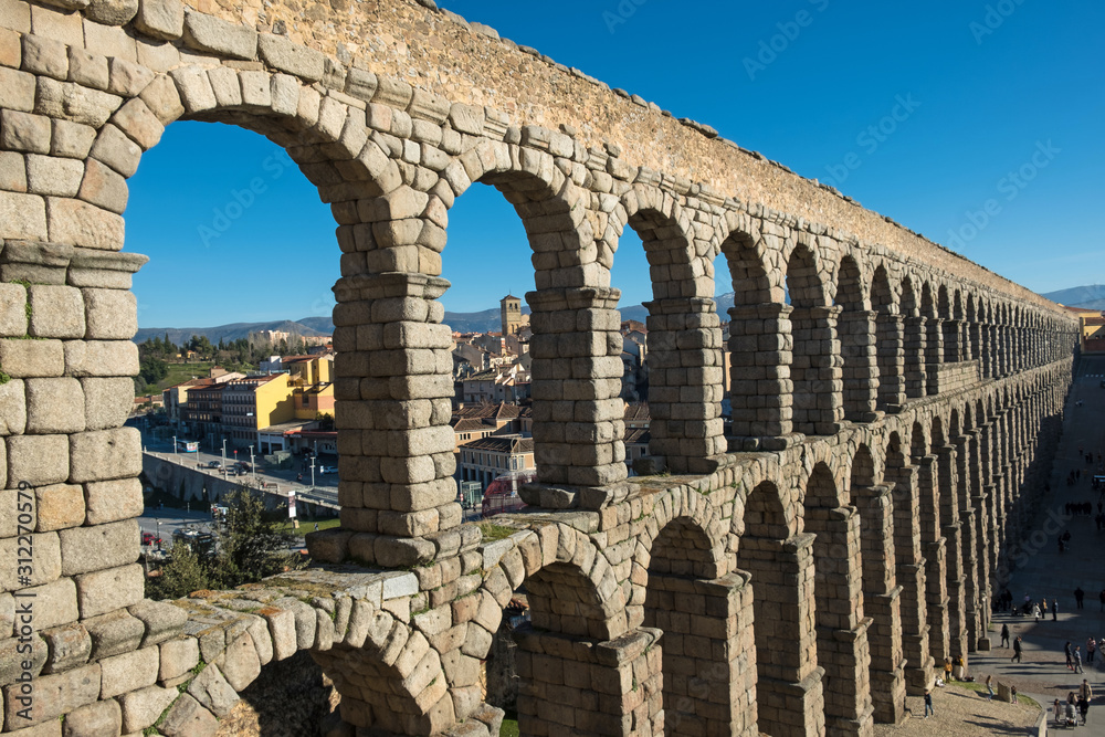 Roman aqueduct in Segovia, Castilla y Leon, Spain - obrazy, fototapety, plakaty 