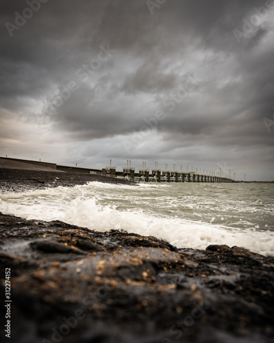 Stormy sea at the Oosterscheldekering, a 9km long storm surge barrier that is part of the Dutch Delta Water Works. photo
