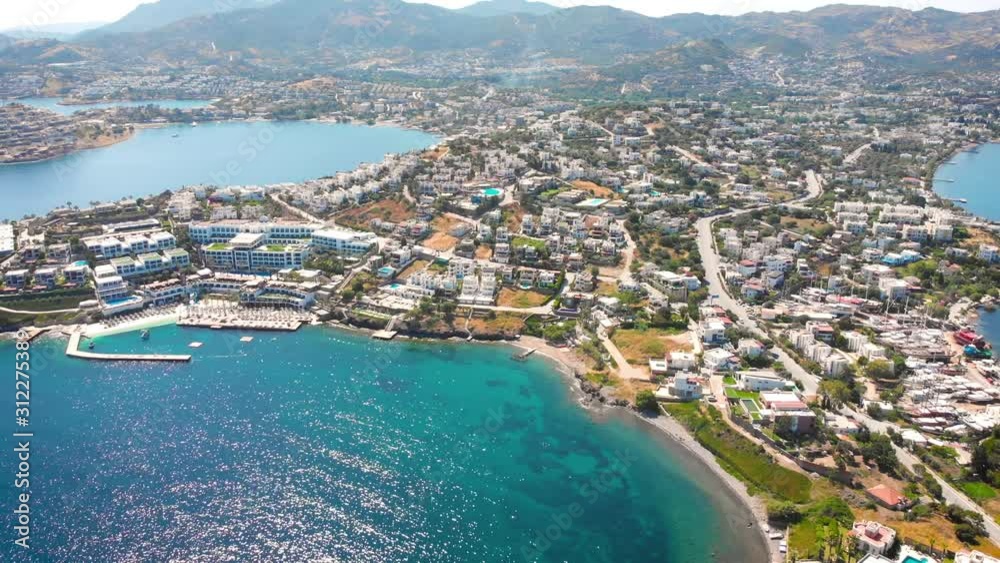 Bird's-eye view of the city with Hotels and white houses on the Ocean coast at noon. Bird's-eye view of the city with Hotels and white houses on the Ocean coast at noon.