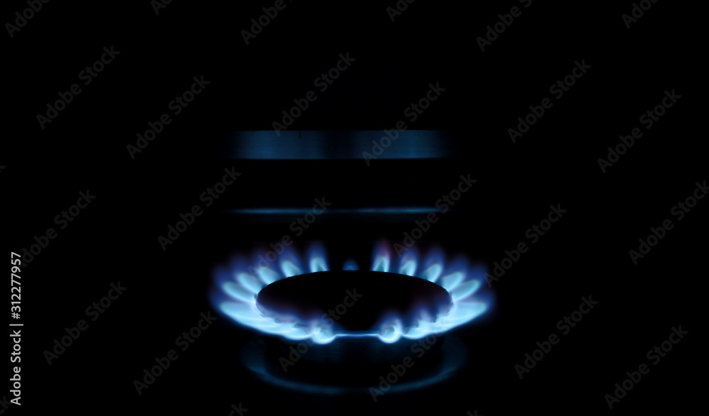 Domestic gas flames burn in the kitchen Domestic gas flames burn in the kitchen