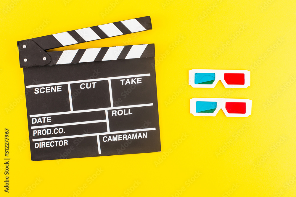 top view of black clapperboard and 3d glasses isolated on yellow