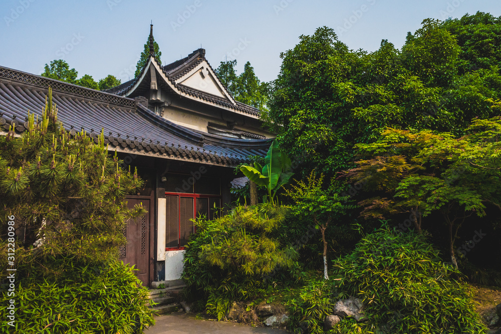 Traditional Chinese architecture among trees near West Lake, Hangzhou, China Traditional Chinese architecture among trees near West Lake, Hangzhou, China