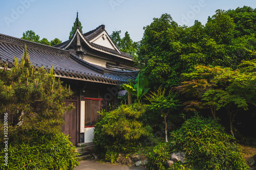 Traditional Chinese architecture among trees near West Lake  Hangzhou  China