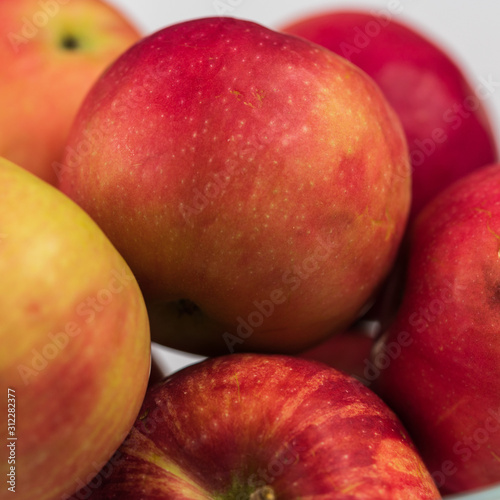 Apples in a clear glass bowl. 