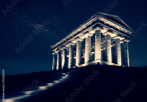 Roman monument and steps lit up at night with the stars in the sky at Penshaw 