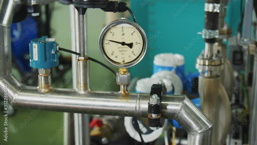 pressure meter with arrow shows data on pipe in workshop pressure meter with arrow shows data on pipe in workshop
