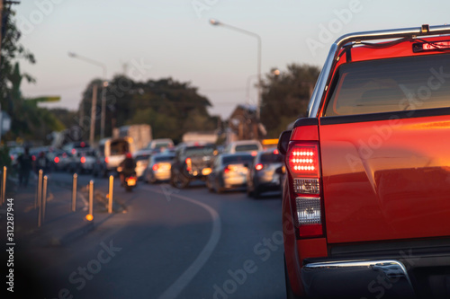 Red car on street road traffic transport.