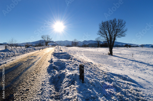 Magnificent landscape of snowy countryside during the winter after the snowfall, in the mountains.