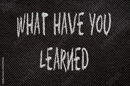 Black background of pattern texture with what have you learned words photo