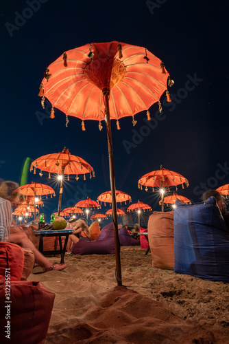 long exposure of the kuta beach bar umbrellas at night photo