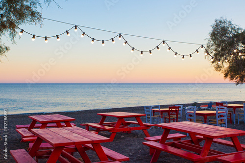 Street cafe on the Perissa beach, Greece photo