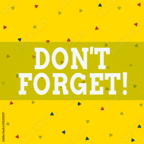 Writing note showing Don T Forget. Business concept for used to remind someone about important fact or detail Triangle Shape Confetti or Broken Glass Scattered Yellow Tone