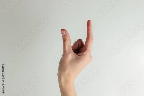 Female hand holds an imaginary object on a white background © splitov27