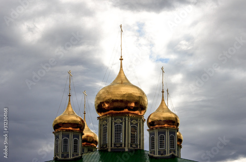 Tula, Russia - September, 16, 2016: Rays of sunlight shining through the gloomy clouds of the dome of the Orthodox Assumption Cathedral in the Tula Kremlin.