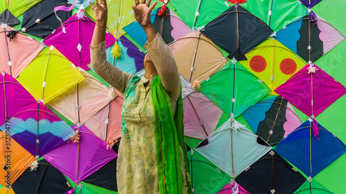 woman with Patang(kite) for Makar Sankranti festival of India. Makar Sankranti is kite festival of India. It is also known as uttarayan photo