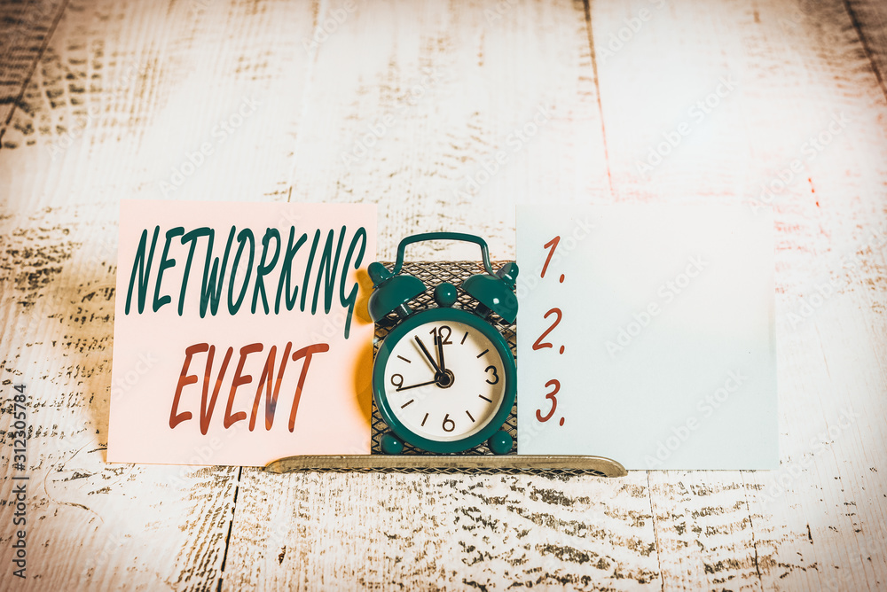 Conceptual hand writing showing Networking Event. Concept meaning Developing and using contacts made in business for purposes Mini blue clock standing above buffer wire between two paper Conceptual hand writing showing Networking Event. Concept meaning Developing and using contacts made in business for purposes Mini blue clock standing above buffer wire between two paper