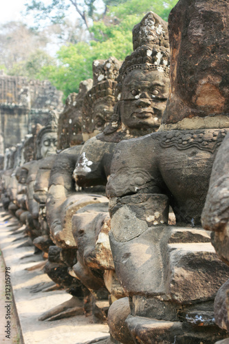 Temple architecture, sculptures and big trees in Southeast Asian countries