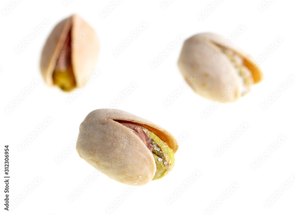 Ripe pistachios nuts isolated on a white background Ripe pistachios nuts isolated on a white background
