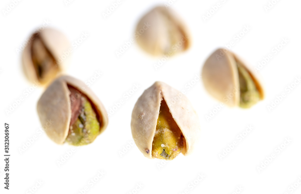 Ripe pistachios nuts isolated on a white background Ripe pistachios nuts isolated on a white background