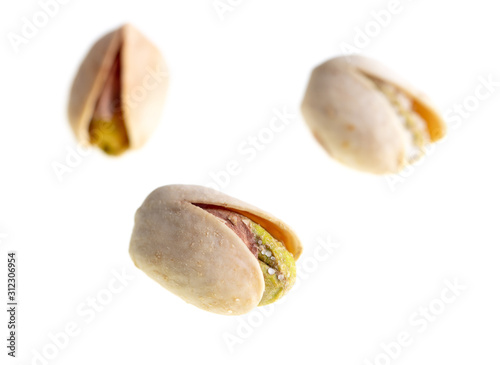 Ripe pistachios nuts isolated on a white background