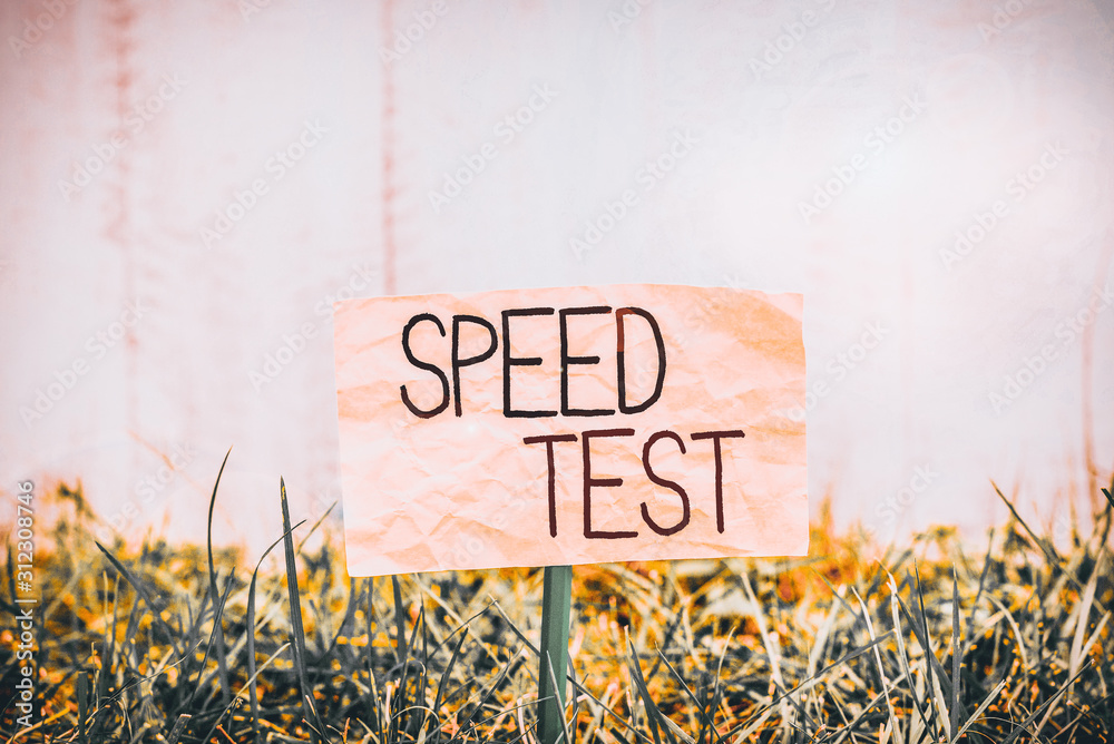 Handwriting text writing Speed Test. Conceptual photo psychological test  for the maximum speed of performing a task Plain empty paper attached to a  stick and placed in the green grassy land Stock