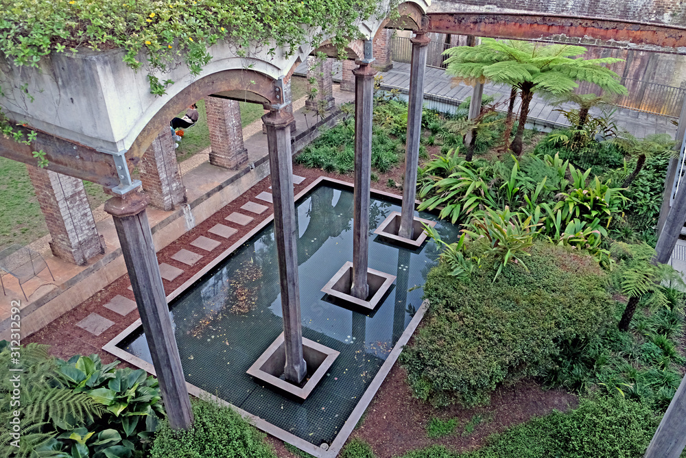 Stone columns and water reservoir in Paddington Reservoir Gardens. It