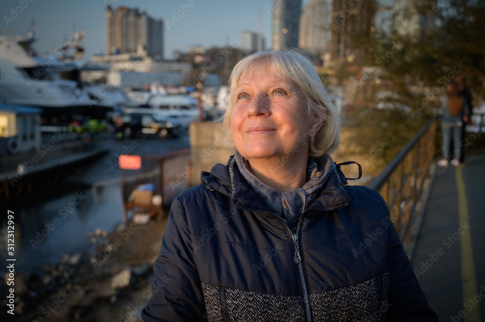 Portrait of a beautiful middle-aged woman at sunset. Portrait of a beautiful middle-aged woman at sunset.