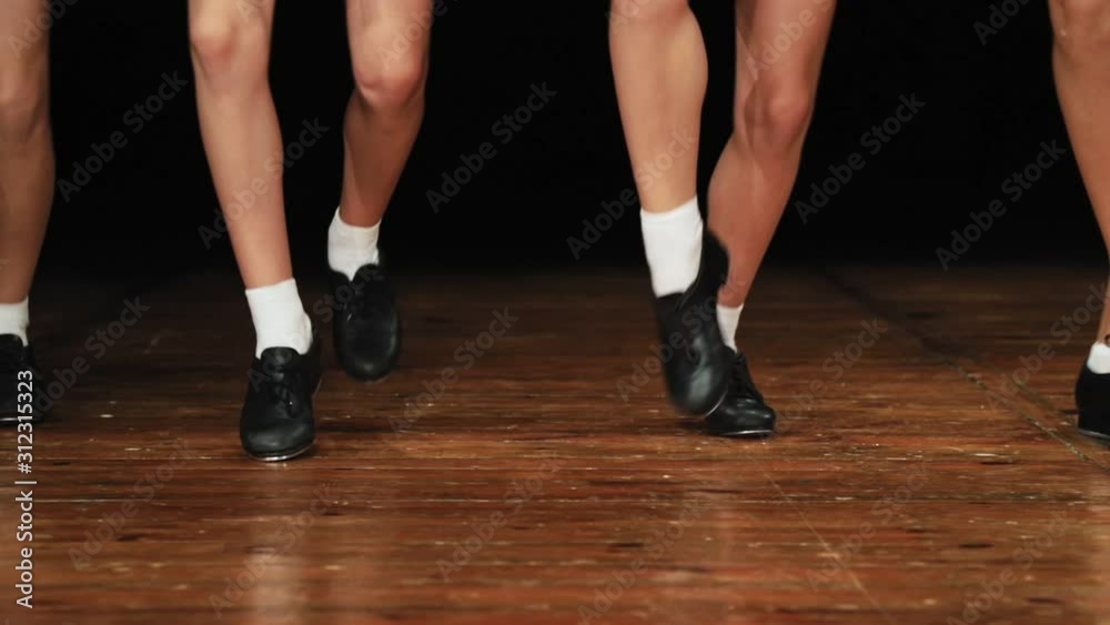 Children perform a dance step and dance. In a special black shoes with metal taps. Slow motion. Close-up Children perform a dance step and dance. In a special black shoes with metal taps. Slow motion. Close-up