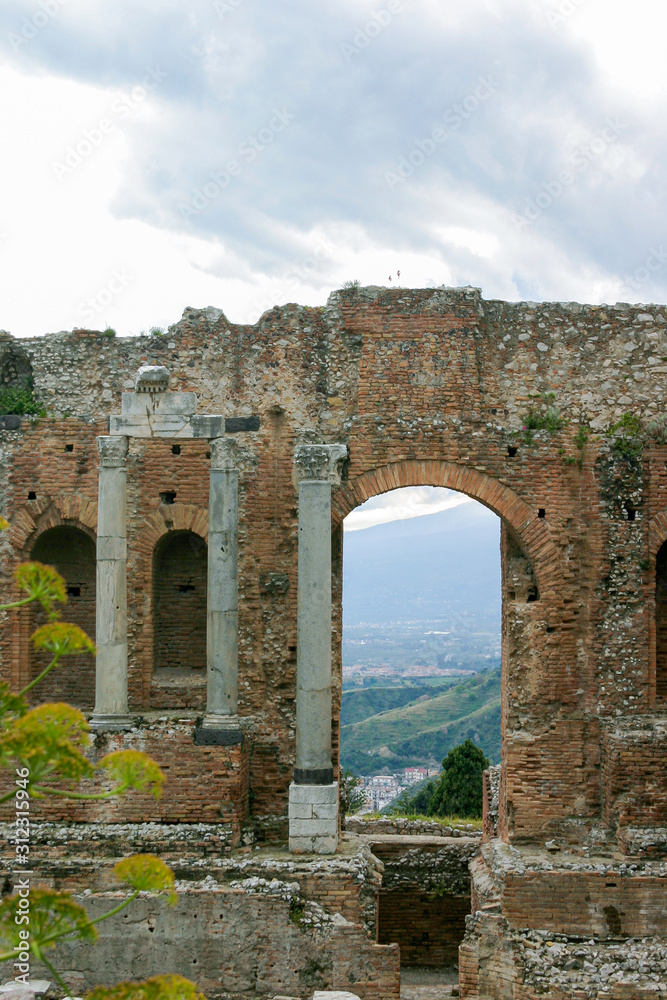 Ruins of ancient Greek theatre in Taormina, Sicily, Italy