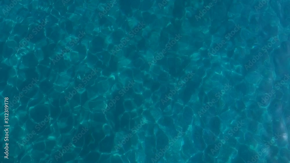 The water surface of the sea, shot as a backdrop for a screensaver.
