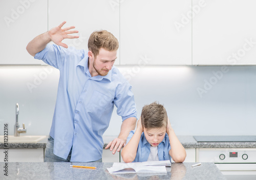 Father scolds his son for poor study