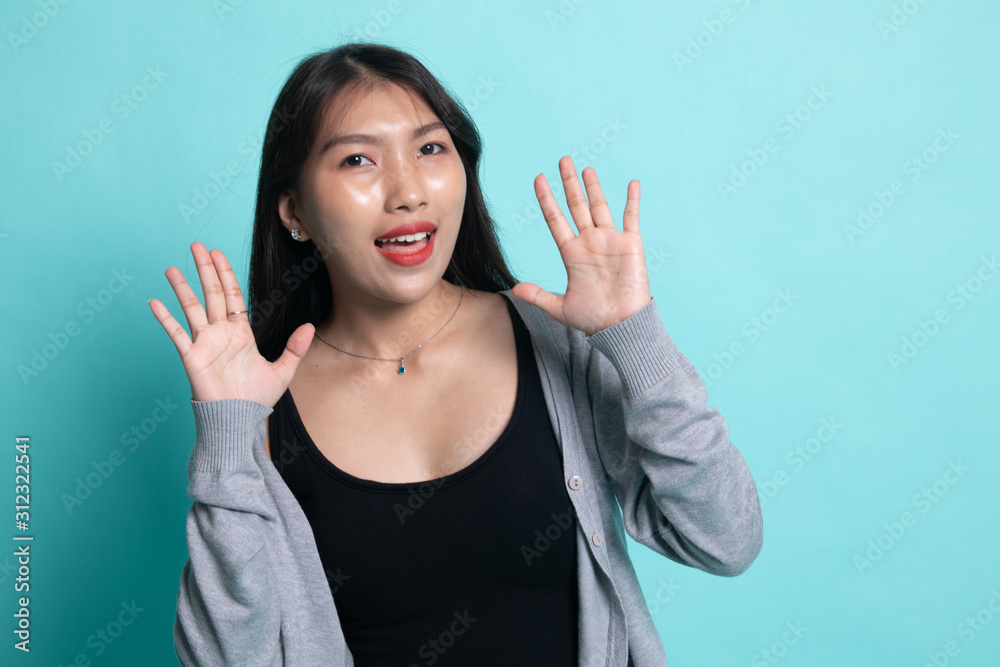 Young Asian woman sticking her tongue out. Young Asian woman sticking her tongue out.