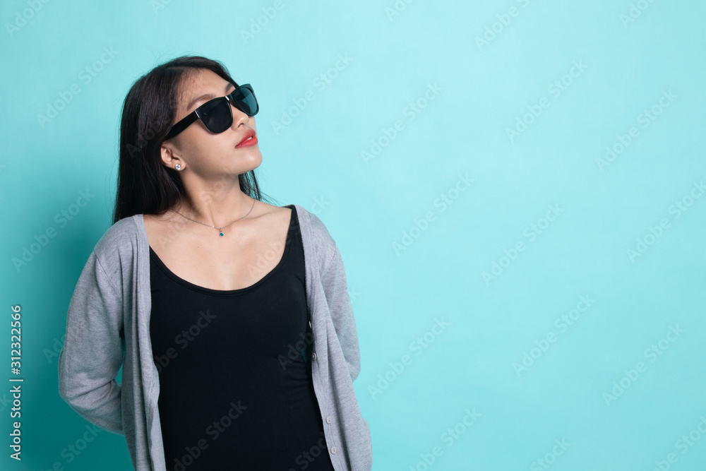 Portrait of a beautiful young asian girl in sunglasses. Portrait of a beautiful young asian girl in sunglasses.