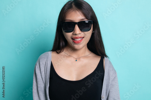 Portrait of a beautiful young asian girl in sunglasses.