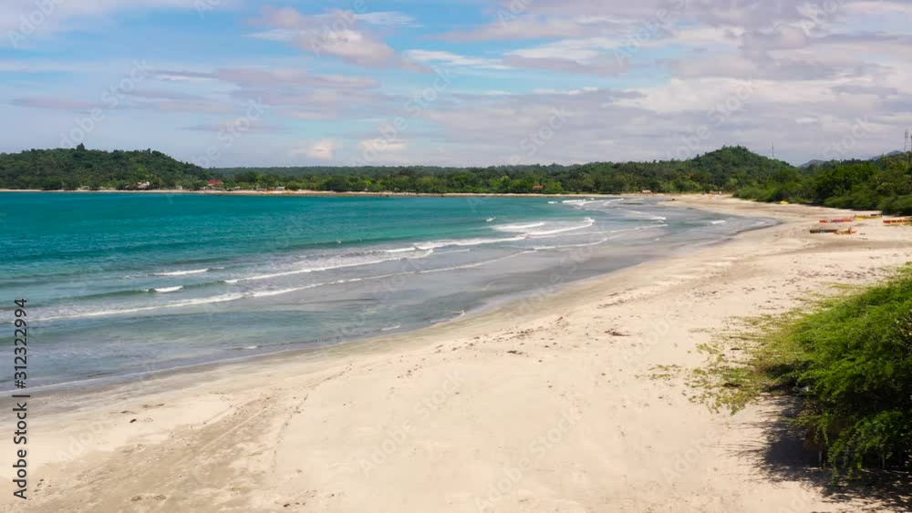 Turquoise lagoon with a sandy beach. Deserted sandy beach on Luzon Island, Philippines. Sea coast with a sandy beach and blue sea. White sand beach and waves. Summer and travel vacation concept Turquoise lagoon with a sandy beach. Deserted sandy beach on Luzon Island, Philippines. Sea coast with a sandy beach and blue sea. White sand beach and waves. Summer and travel vacation concept