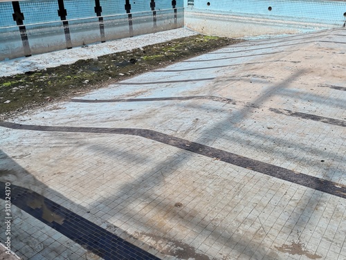 old dirty pool with no water